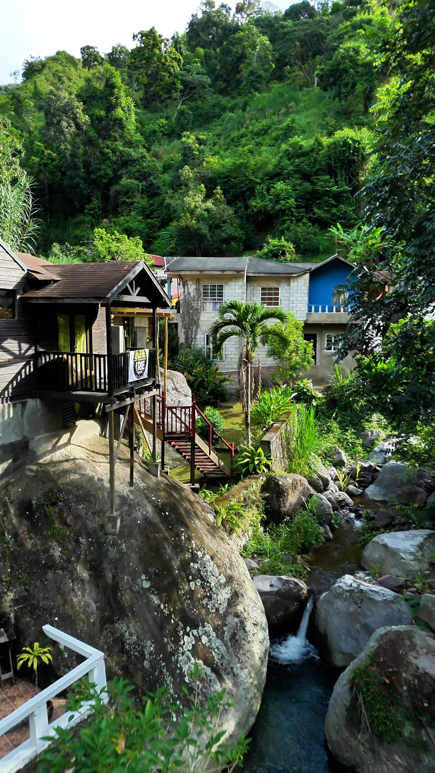 Wooden cabins on the rocks above a mountain stream at Irish Town